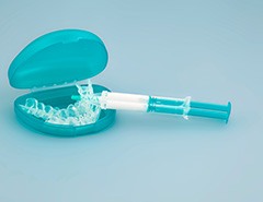 Teal and white whitening applicator trays and gel