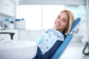 Smiling woman in dental exam room